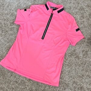 Jamie Sadock short sleeve hot pink and black golf shirt.